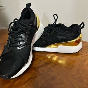 Puma Women's Black and Gold Sneakers
